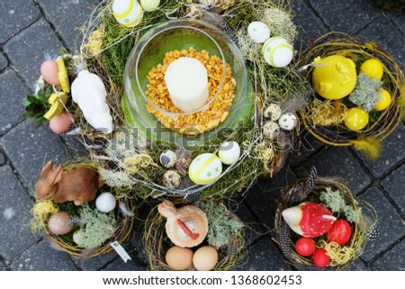Selection of beautiful traditional easter baskets full of colored eggs, bunnies and festive decorations 