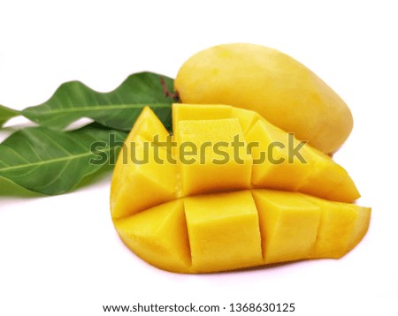 Sweet ripen  mango in a yellow color and a cut mango isolated on a white background, popular asian fruit during the summer