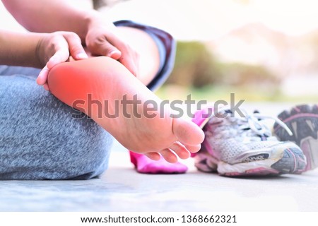Heel pain and foot (plantar fasciitis).
Caused by exercise or running. Royalty-Free Stock Photo #1368662321