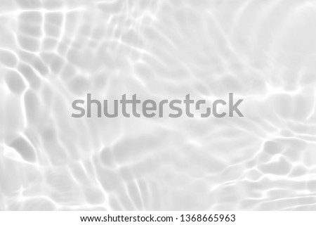 white wave abstract or rippled water texture background Royalty-Free Stock Photo #1368665963