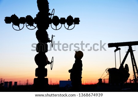In the evening，oil field, the oil workers are working