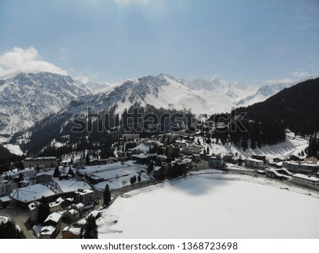 Aerial panorama view of swiss ski resort Arosa in Glaubuenden, Switzerland, winter and snow