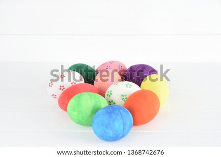 Colorful handmade easter eggs on white wooden background. Happy Easter Day, Easter eggs concept.