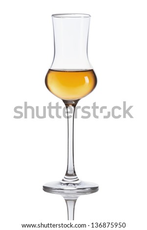 Glass of dark italian Grappa brandy isolated on white background Royalty-Free Stock Photo #136875950
