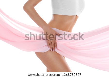 Young woman covering her body with silk fabric on white background, closeup. Beauty care Royalty-Free Stock Photo #1368780527