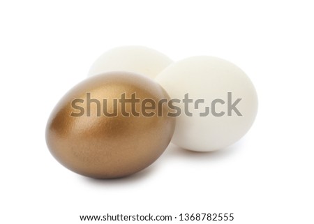 Golden egg among ordinary ones on white background