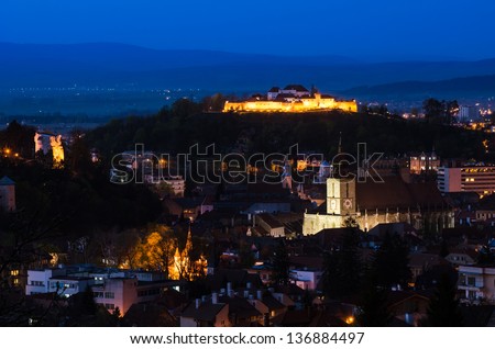 Skyline view over the small fortress of Brasov situared uppon a hill in ther center of the city