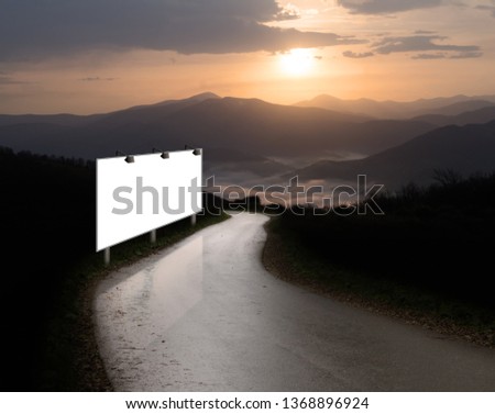 Blank white billboard near roadway in the mountain. Empty space for text. Isolated white screen. Mockup for advertising banners. Image