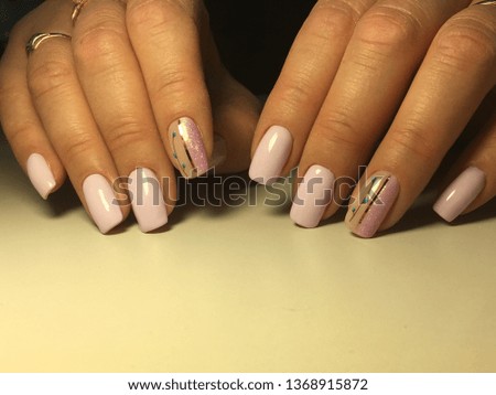 fashionable lilac manicure on a textural background