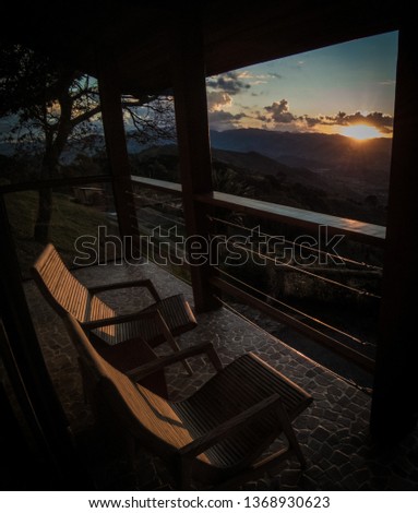Relaxing moment with the view to the sunset in the Serra da Mantiqueira, São Paulo, Brazil