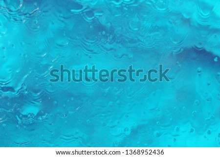 blue water in swimming pool in rain ripples cyan blue  stock, photo, photograph, picture, image