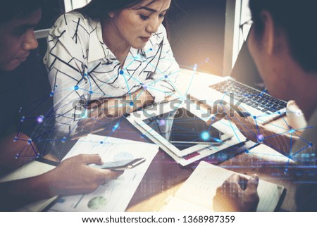 Business peoples using smart devices with digital visual effect as connection network for their business success