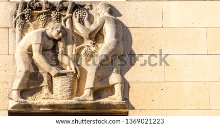 Detail of Grape Harvest on an Old Building in Syracuse, Sicily, Italy Royalty-Free Stock Photo #1369021223