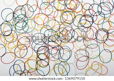 abstract background with colored rubber bands for money on a white background