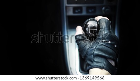 Gear lever. Manual Transmission. Hand on the gear shift in a car. Royalty-Free Stock Photo #1369149566