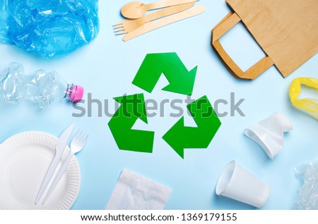 Recycling Symbol, Waste Recycling and Litter over Light Blue Background