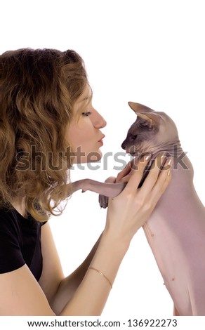 girl kissing a cat on a white background in profile