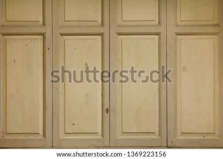 Close up and beautiful brown wooden window on vintage tone background or texture pattern for concept design and decoration