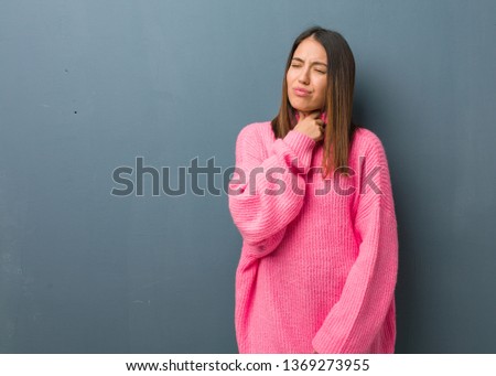 Young modern woman coughing, sick due a virus or infection
