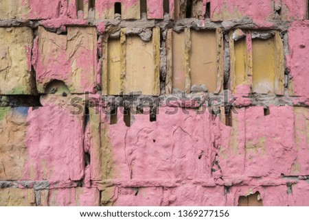Pink wall. A broken, old wall. Close up.