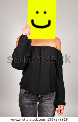 girl with  paper over face, emoticon smile drawing