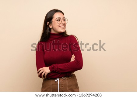 Teenager girl with glasses happy and smiling