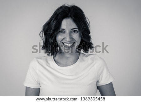 Black and white portrait of young pretty caucasian woman with happy face and beautiful smile staring at the camera. Isolated on white. In People, positive human facial expressions and emotions.