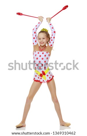 Beautiful little girl gymnast performs exercises with a mace. The concept of children's sports, fitness. Isolated on white background.