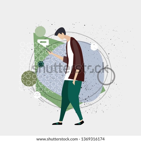 Young tall man walking with mobile phone