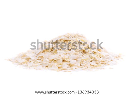 A heap of organic and healthy quinoa flakes on white background. Royalty-Free Stock Photo #136934033