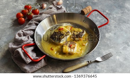 bacalao al pil pil, salted cod in emulsified olive oil sauce, spanish cuisine, basque country