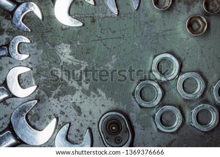 Wrench. Metal background with scratches. Garage service. Tools for repair. Free space for inscriptions.