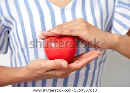 hand holding red heart shaped ,healthcare and medicine concept