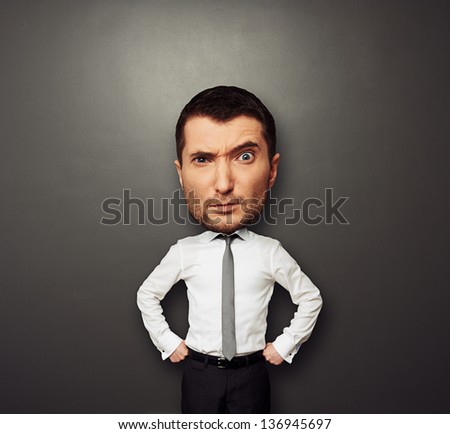 funny picture of businessman with big head over dark background