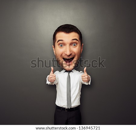 happy businessman with big head showing two thumbs up and laughing. funny picture over dark background