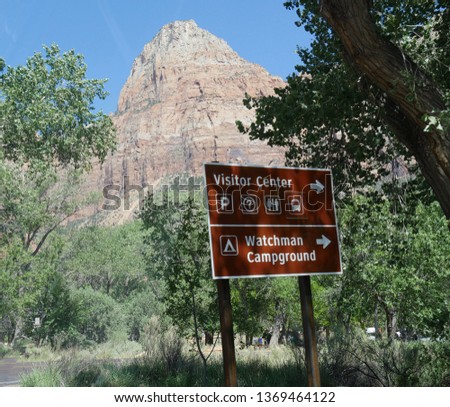 Road side sign with directions to the Visitor Center and watchman campground at Zion National Park, Utah, USA.