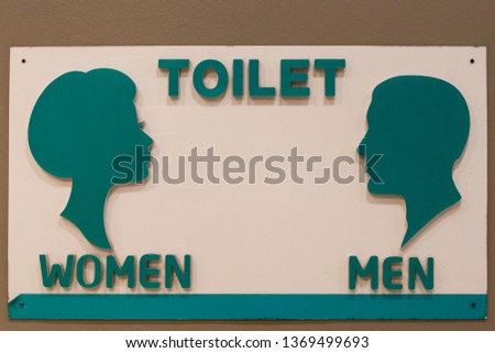 Restroom sign on a toilet, Toilet sign.