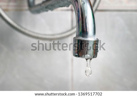 Dripping Old Silver Faucet, Tap. Bath or Kitchen Faucet Gasket Needs Repair. Royalty-Free Stock Photo #1369517702