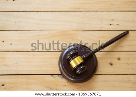 Hammer on the wooden table 