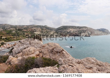 Wonderful beach in Southern Cyprus is named petra de romiou. View from rock on other rock. Summertime. Time for swim. Beauty of Cyprus. Photograph standing on Aphrodite's Rock. Rock of Greek.