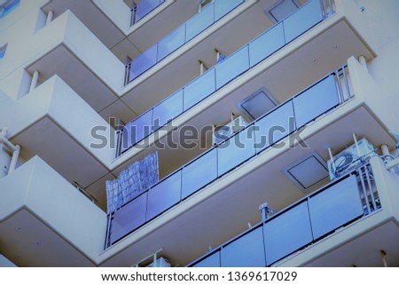 Apartment in the center of the city of Japan, many people living in it.architecture, background, modern, city, white, black, architectural, structure,  contemporary.