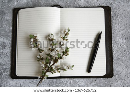 
page in line for text and blooming twig