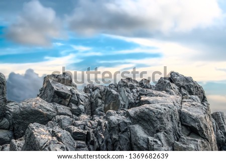 Typical Beach Rock Structure, made up of Basaltic and Igneous Rocks, been constantly eroded from centuries by ocean waves, found in abundance on all the beaches of Western Ghats of India. - Image Royalty-Free Stock Photo #1369682639