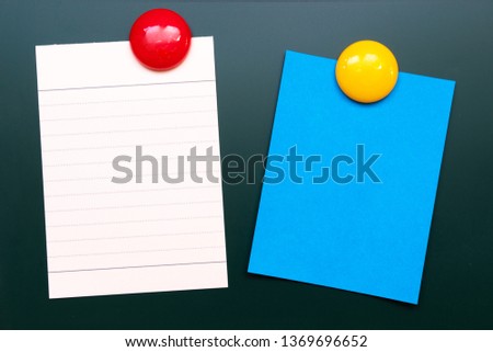Empty colorful paper sheet with magnetic on rubbed out  green board chalkboard texture background  Copy space for add text or art work designs.