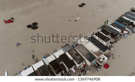 Aerial bird view photo of beach houses sometimes used as a vacation or second home for people who commute to the house on weekends or during the holiday periods located in Holland