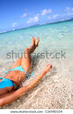 Closeup of woman body bathing in Caribbean sea