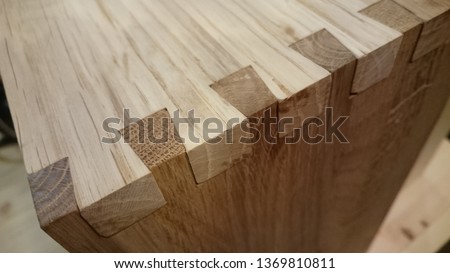 Dovetail joinery on oak wood Royalty-Free Stock Photo #1369810811