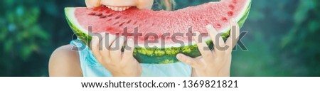 A child eats watermelon. Selective focus. nature