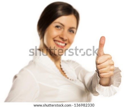 Happy smiling cheerful young business woman with okay gesture