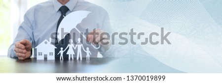 General agent protecting a family and a house with his hands. panoramic banner